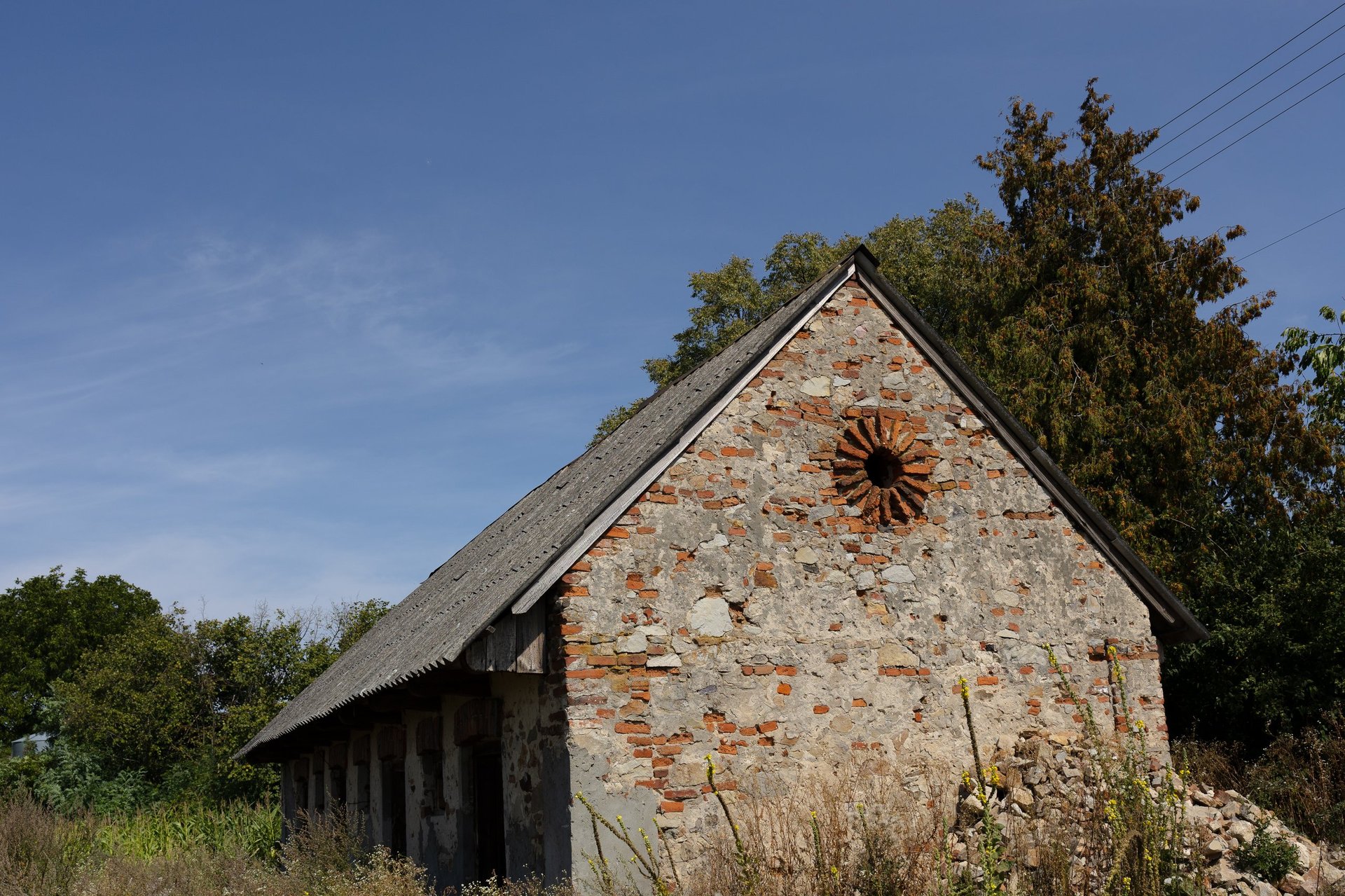 Historic stone barn in the countryside at golden hour